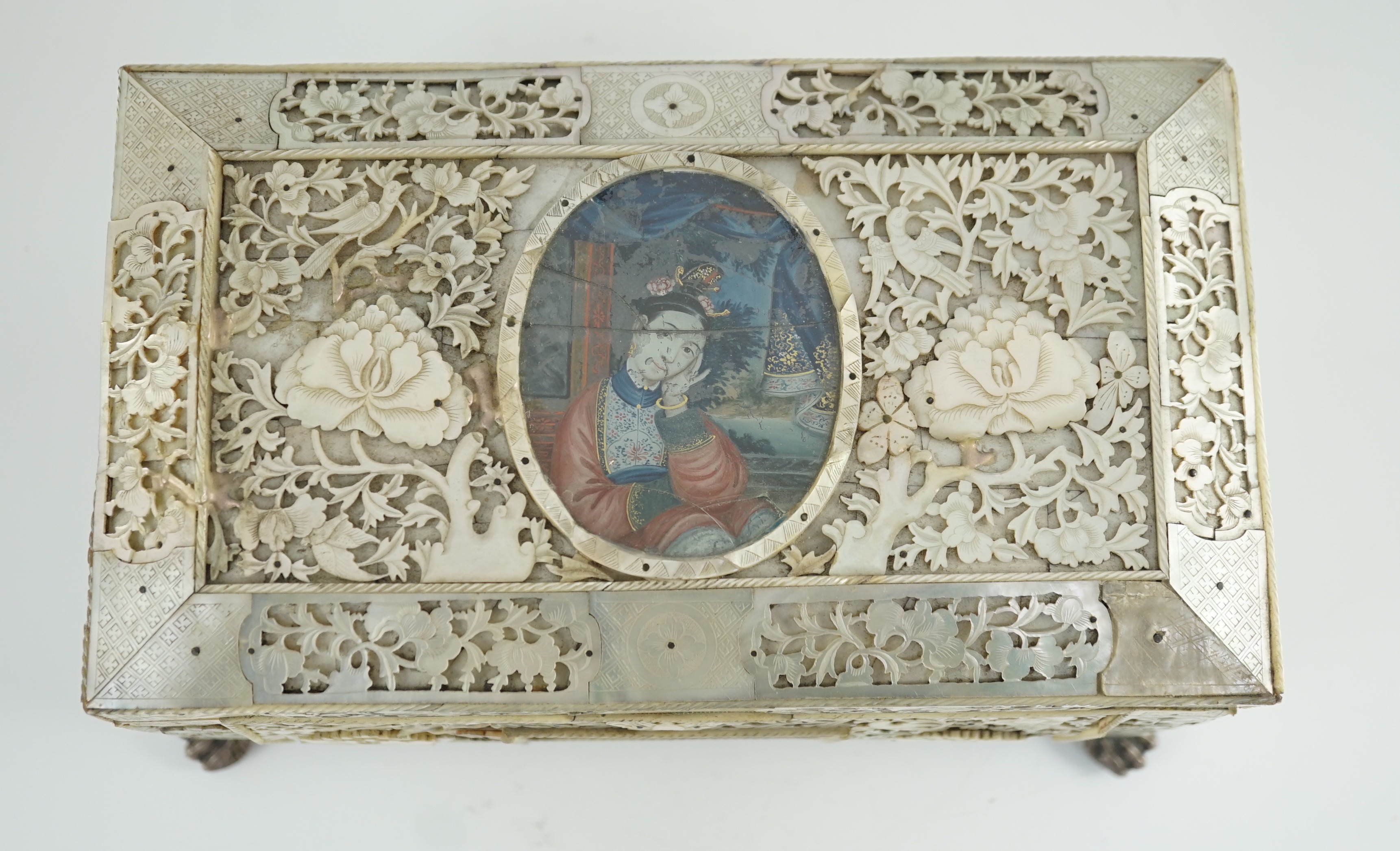 A rare Chinese export mother-of-pearl and reverse painted glass mounted casket, late 18th century, 27.5cm wide at feet, 15.5cm high, some damage